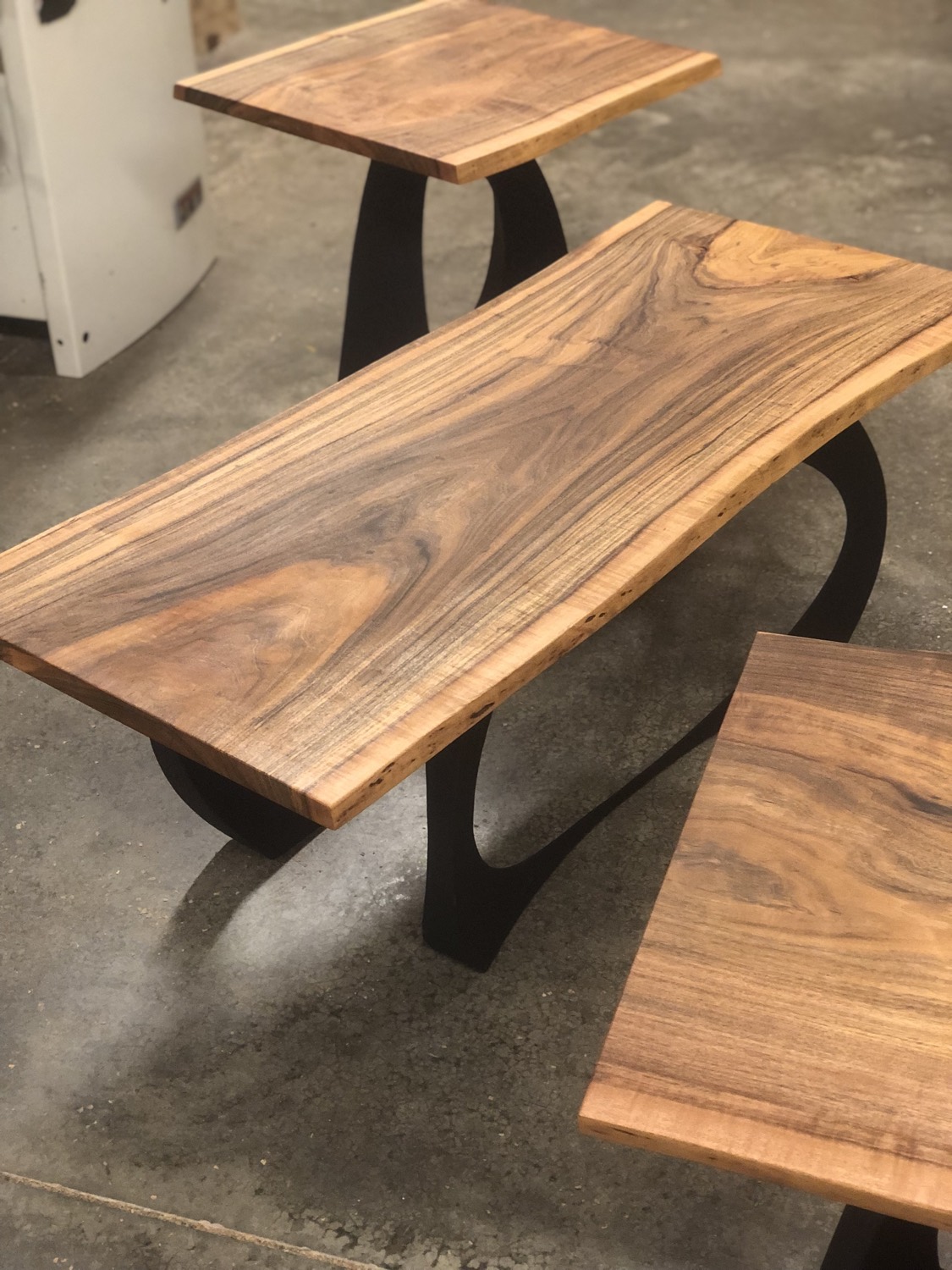 Rosewood live-edge living room set with black steel legs