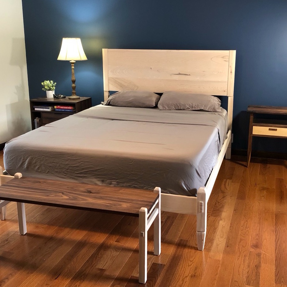 Ash bed frame, nightstand, and bench in a staged bedroom