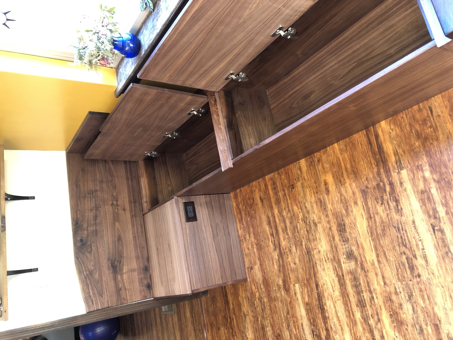 Built-in walnut corner bench with lift-up storage